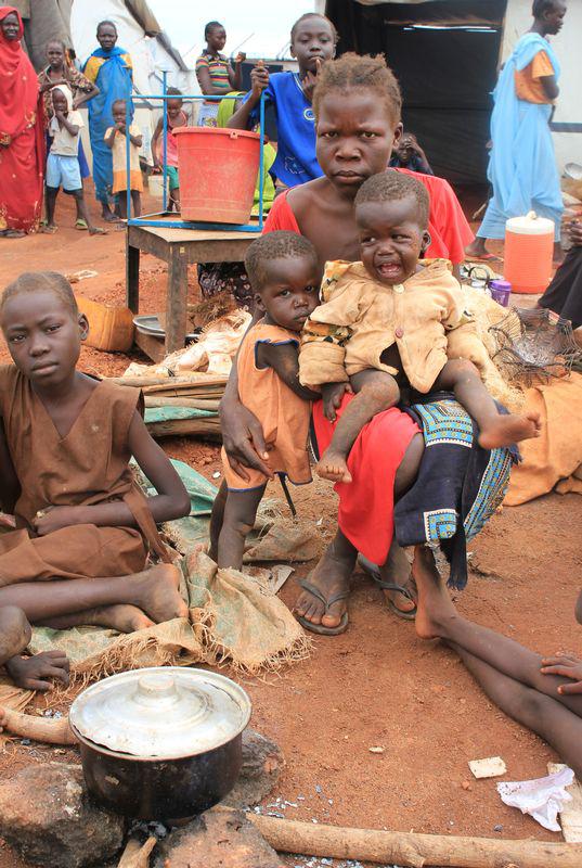 Christine Elia, 27, holds her twin sons at a displaced persons camp protected by U.N. peacekeepers in Wau, South Sudan, September 4, 2016. 2016. 