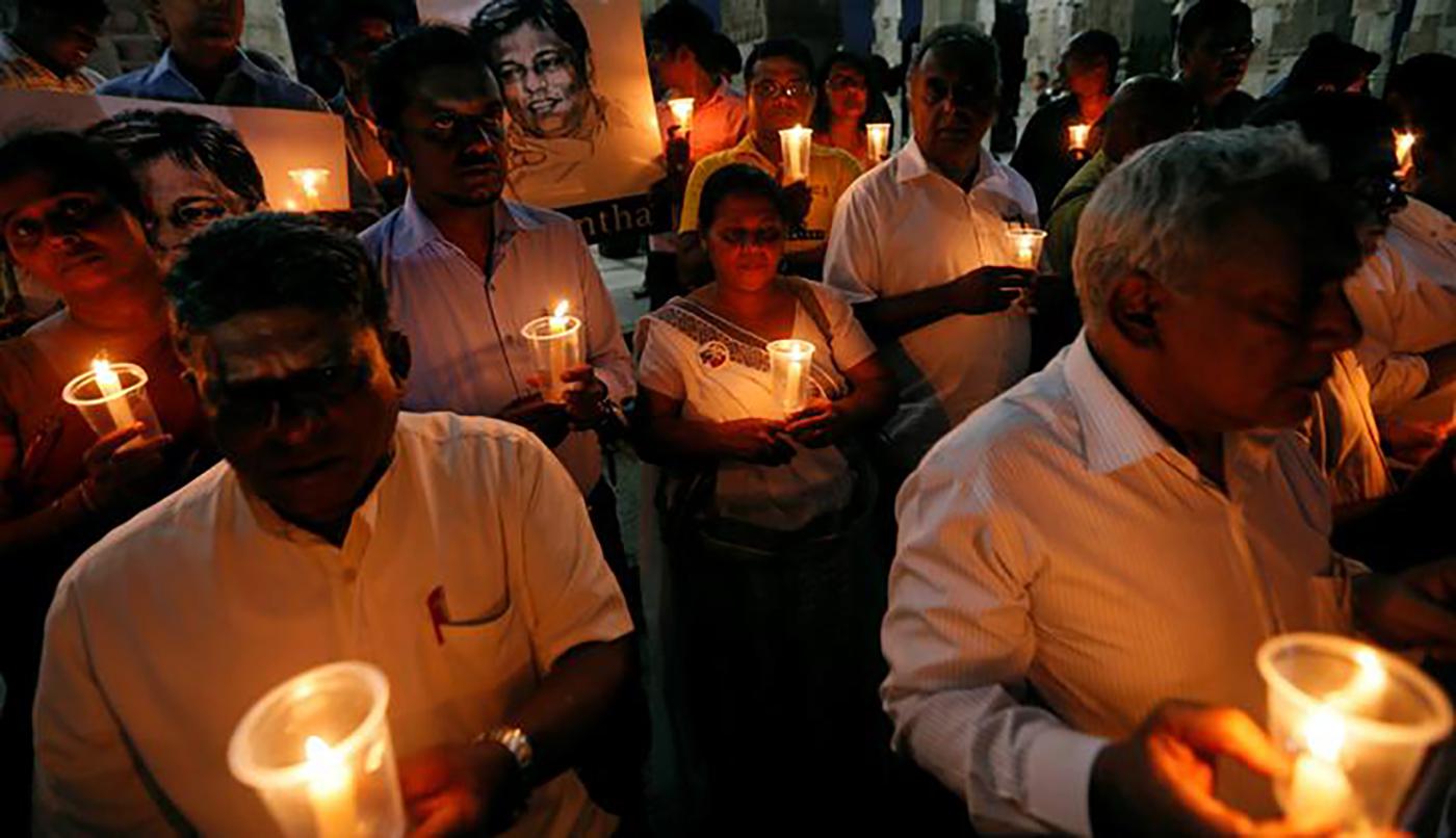 Demonstrators hold candles at a “Black January” vigil to commemorate killings and disappearances of Sri Lankan journalists, Colombo, Sri Lanka, January 24, 2017.