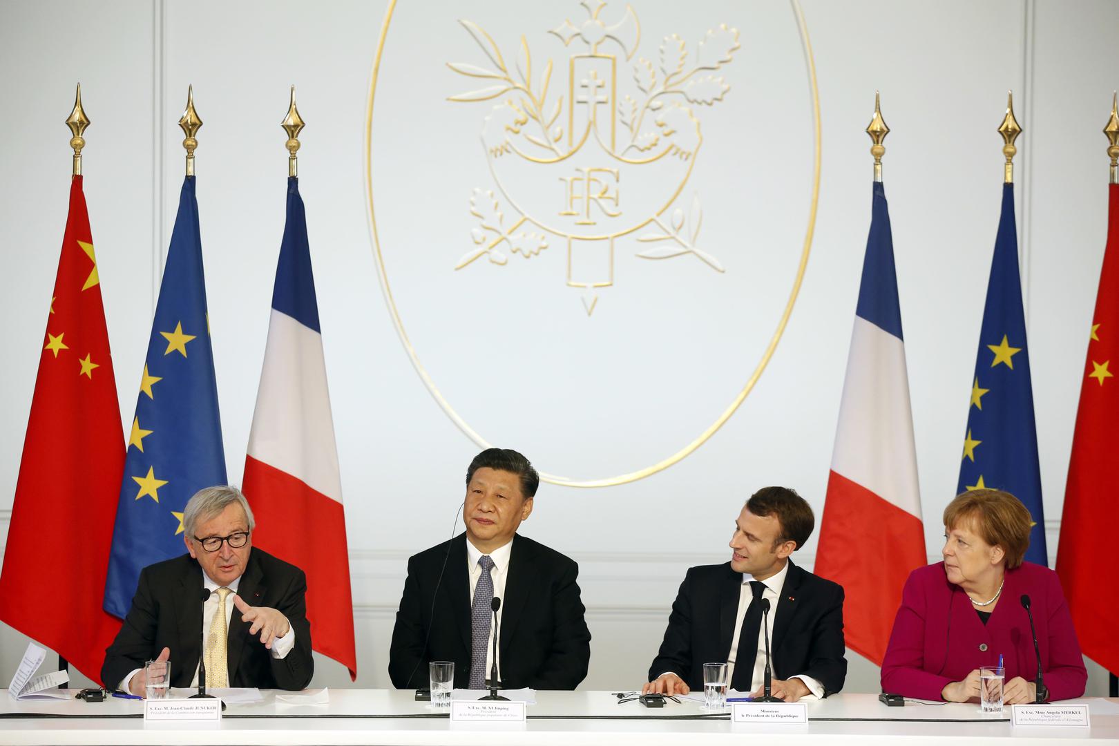 European Commission President Jean-Claude Juncker, Chinese President Xi Jinping, French President Emmanuel Macron, and German Chancellor Angela Merkel hold a press conference in Paris, March 26, 2019.
