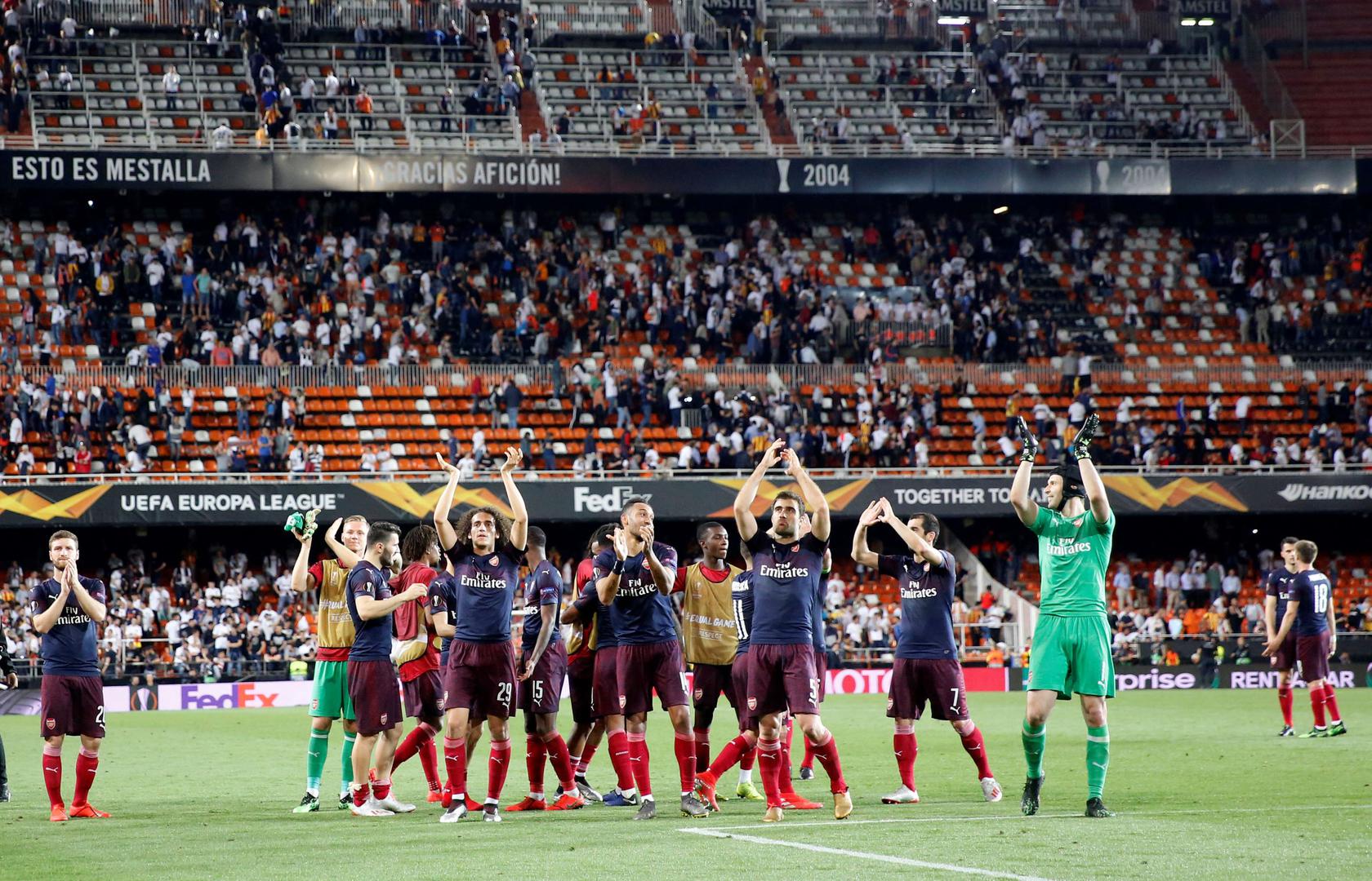Arsenal players celebrate winning their Europa League football match semifinal against Valencia at the Camp de Mestalla stadium in Valencia, Spain, Thursday, May 9, 2019.
