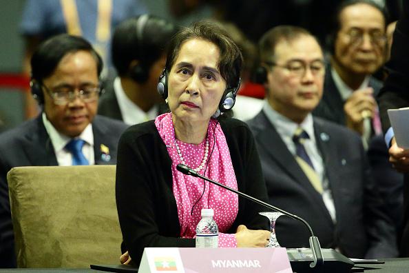Myanmar State Counsellor Aung San Suu Kyi listens to China Premier Li Keqiang at the ASEAN-China Summit during the 33rd ASEAN Summit on November 14, 2018 in Singapore. 