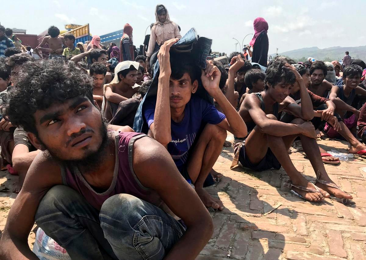 Rohingya refugees gather after being rescued in Teknaf near Cox’s Bazar, Bangladesh, April 16, 2020.