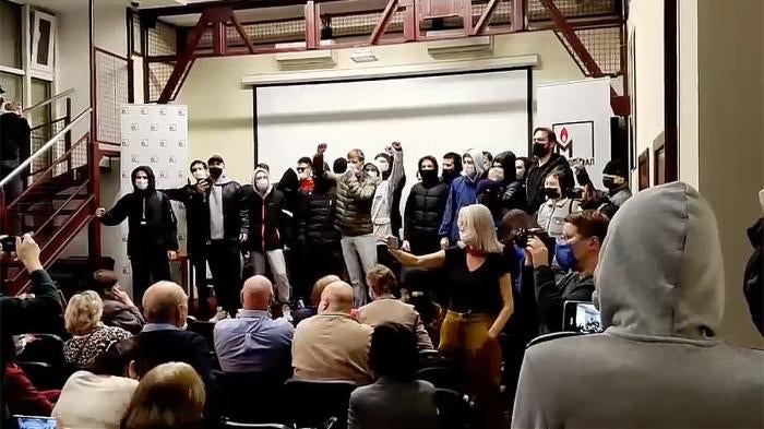 Intruders disrupting film screening at Memorial and yelling “get out of here” and “fascists. Moscow, October 14, 2021.