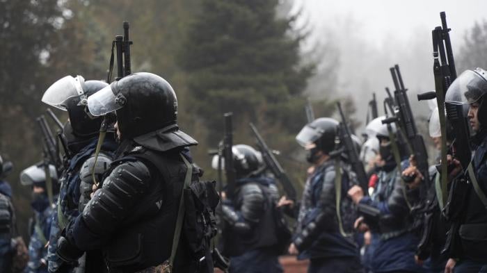 Riot police officers holding 12-gauge shotguns, which can fire both lethal and less-lethal ammunition, in Almaty, Kazakhstan, on Wednesday, Jan. 5, 2022.