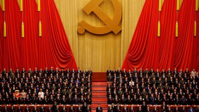 Chinese President Xi Jinping, front row center, stands with other officials