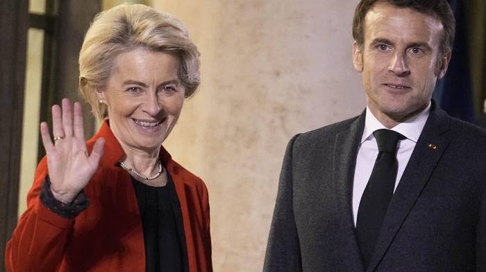 France's President Emmanuel Macron, right, welcomes European Commission President Ursula von der Leyen, at the Elysee Palace, in Paris, December 12, 2022.