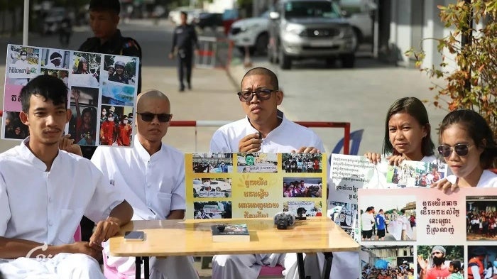 Five Cambodian activists record a podcast.