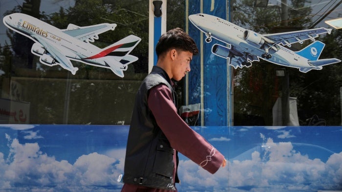 A man walks in front of an air travel agency in Kabul, Afghanistan
