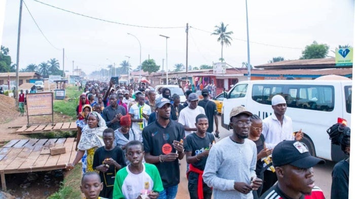 A crowd is marching.