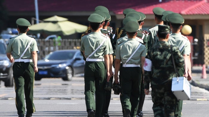 Chinese paramilitary police at the Beijing airport prepare for the departure of North Korean leader Kim Jong Un on June 20, 2018.
