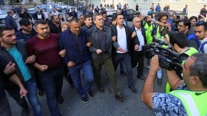 Head of the Popular Front Party of Azerbaijan Ali Karimli (C) and his supporters hold an unauthorized rally to demand the right to freedom of assembly, in Baku, Azerbaijan, October 19, 2019.