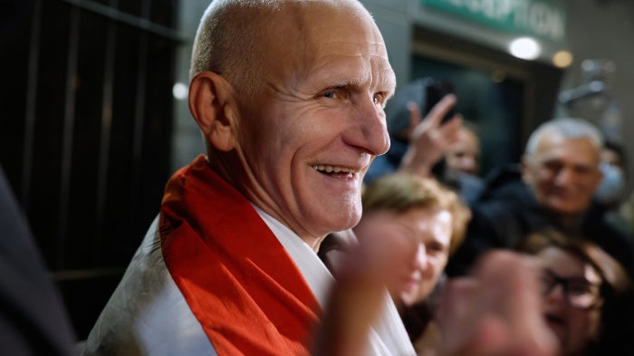Nobel Peace Prize laureate Ales Bialiatski, one of released Belarusian prisoners, smiles as he arrives at the U.S. Embassy in Vilnius, Lithuania, on December 13, 2025.