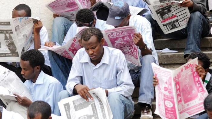 Newspaper readers at Arat Kilo, a square in Addis Ababa, Ethiopia.