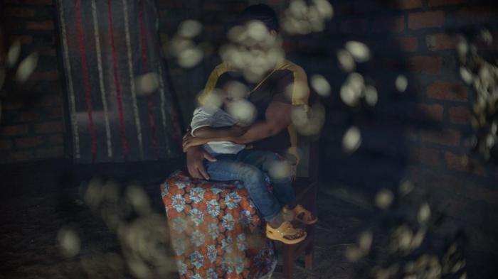 Angèle, 27, holds her child in Bangui. Seleka fighters killed her husband and parents, and later captured her near Bambari in June 2014, she said. They held her in sexual slavery for nine months with five other women and girls. Multiple fighters raped her