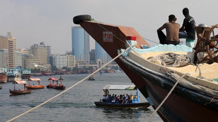 Iranian workers rest on a commercial ship at Dubai Creek, January 17, 2016. 