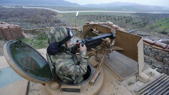 A Turkish soldier surveys the border line between Turkey and Syria near the city of Kilis, March 2, 2017. 