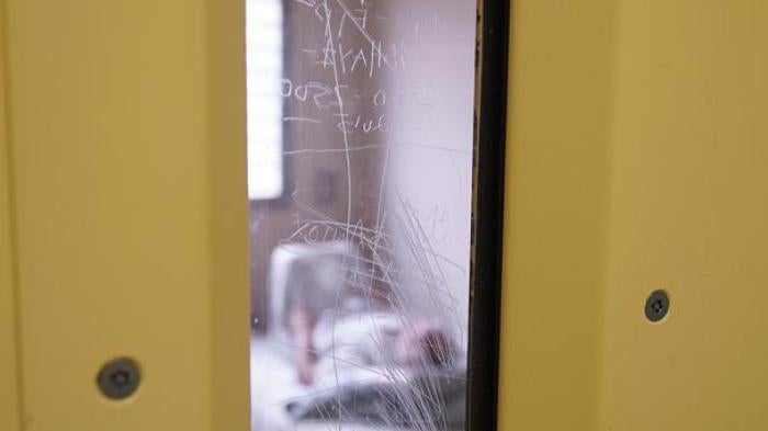 A prisoner lies in his bed in a solitary confinement cell in the safety unit at Lotus Glen Correctional Centre, northern Queensland. 