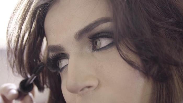 Lebanese Trans woman putting make up on.