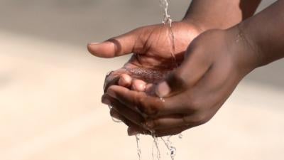 Hands cupping water