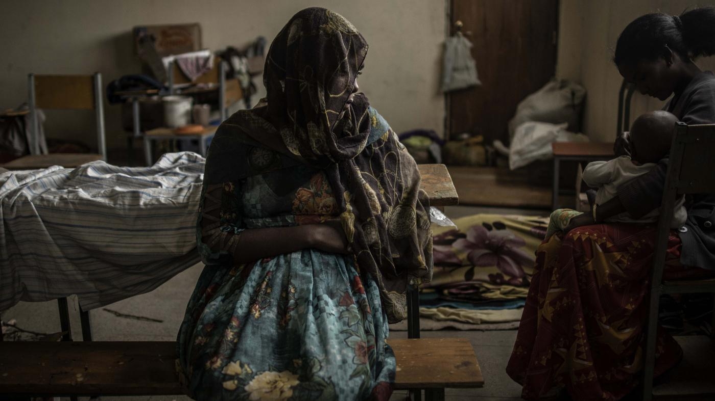  A woman sits at a school being used to house people displaced by fighting, in the city of Mekelle in Ethiopia's northern Tigray region on June 27, 2021.
 © 2021 Finbarr O’Reilly/The New York Times/Redux