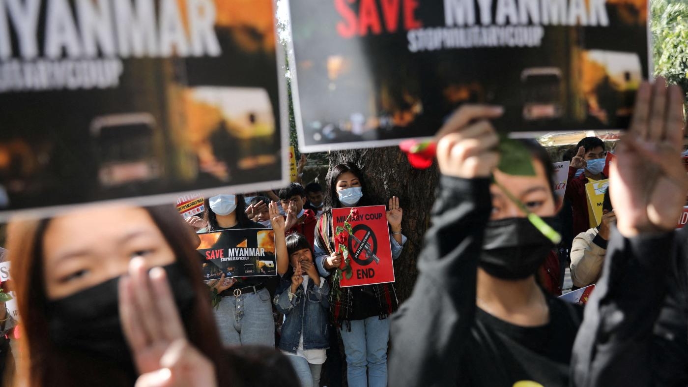  Myanmar citizens living in India hold placards during a protest in New Delhi against the military coup in Myanmar and supporting recognition of the National Unity Government of Myanmar, February 22, 2022.
 © 2022 Anushree Fadnavis/Reuters