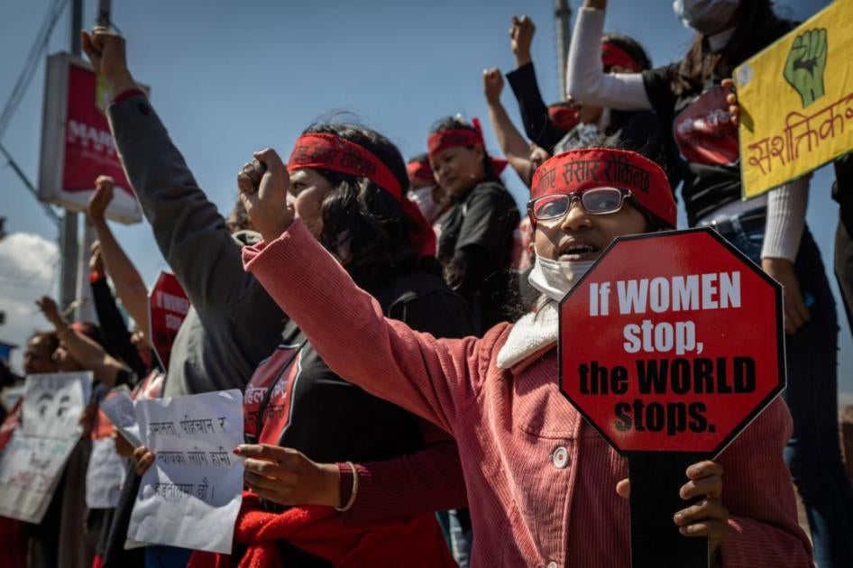 Women hold placards during a protest against sexual violence in Kathmandu, Nepal