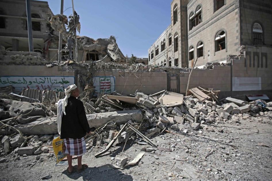 A man looks at damaged buildings after deadly airstrikes in Sanaa, Yemen, on May 7, 2018. 