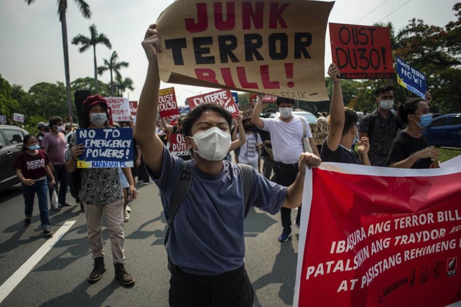 A protester carries a sign at a rally against the draft Anti-Terrorism Act in Quezon City, Philippines, June 4, 2020.