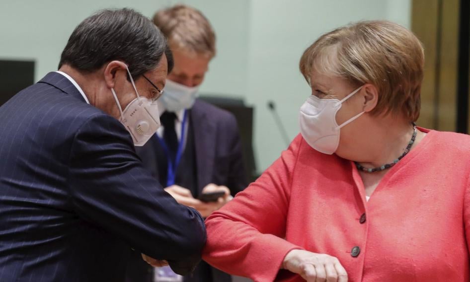 German Chancellor Angela Merkel greets Cypriot president Nicos Anastasiades at the EU summit in Brussels, July 21, 2020.