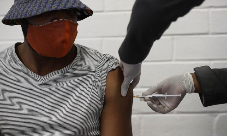 A person in Soweto, South Africa receives an injection as they participate in a clinical trial for a Covid-19 vaccine in June 2020. 