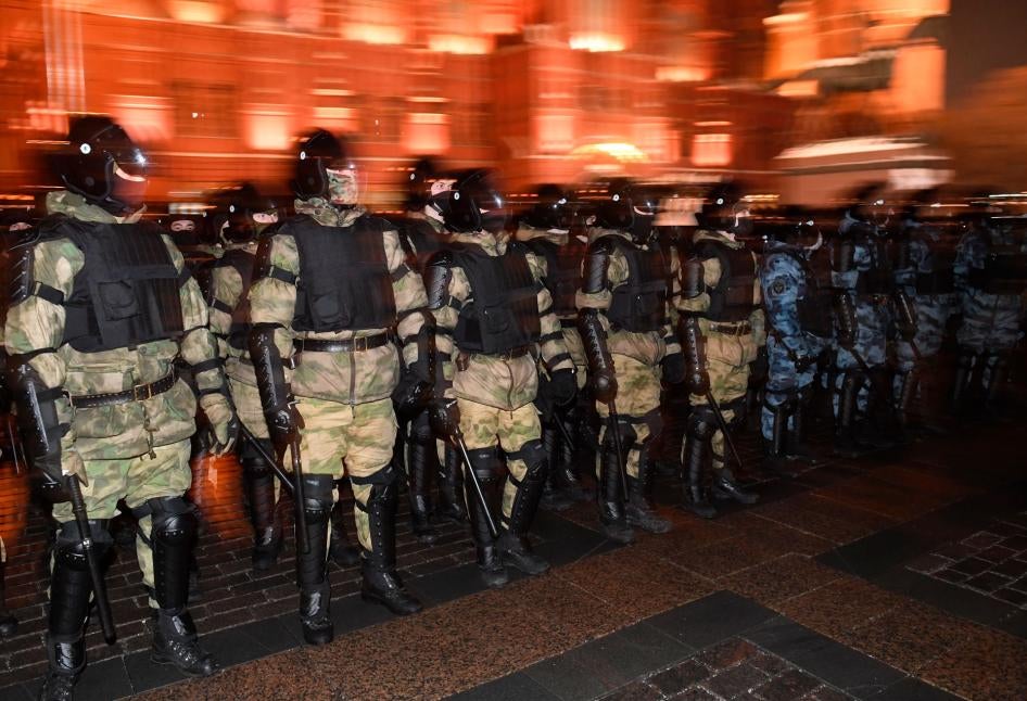 Law enforcement officers block access to Red Square in central Moscow, Russia, ahead of a rally protesting a court decision to imprison Russian opposition activist Alexey Navalny, by replacing his suspended sentence with jail time, February 2, 2021.