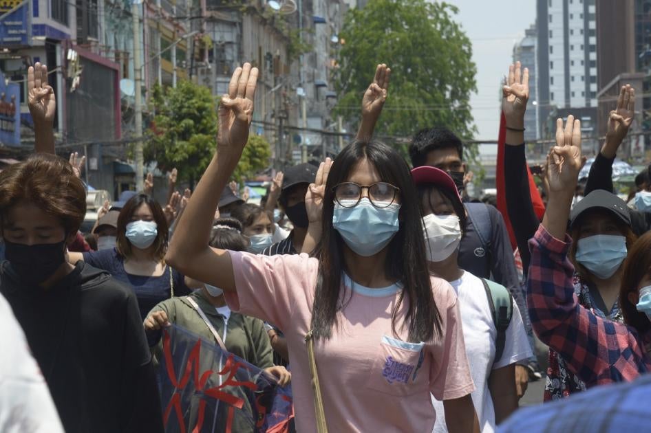 Anti-coup protesters flash the three-finger sign of defiance during a demonstration in Yangon, Myanmar on April 23, 2021.