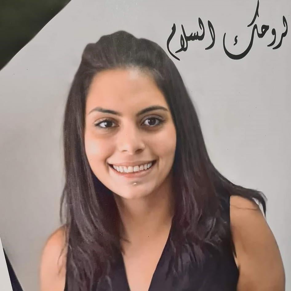 A picture of Suha Jarrar and flowers prepared by the staff of the Palestinian human rights group al-Haq and displayed at a commemoration for Jarrar in Ramallah in the Israeli-occupied West Bank on July 12, 2021 