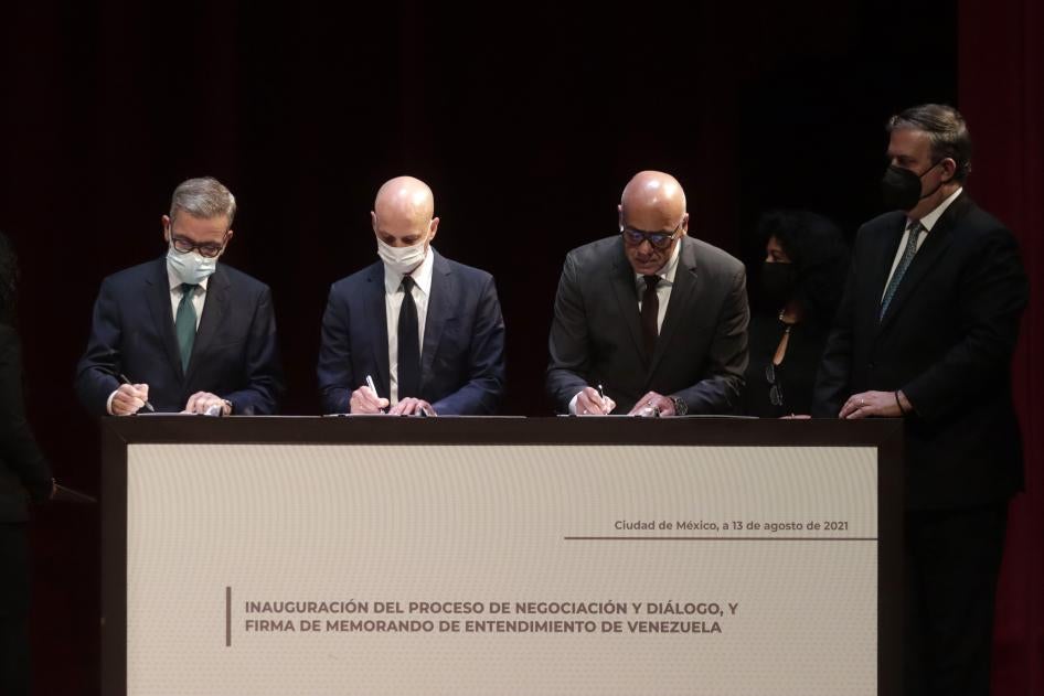 Head of the Venezuelan opposition delegation Gerardo Blyde, Kingdom of Norway representative Dag Nylander, Venezuelan National Assembly President Jorge Rodríguez, and Mexican Foreign Affairs Minister Marcelo Ebrard during the Inauguration of the Negotiation and Dialogue Process and Signature of the Memorandum of Understanding of Venezuela, at the National Museum of Anthropology on August 13, 2021, in Mexico City.