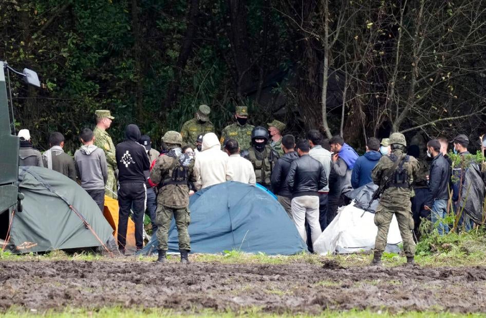 Polish security forces surround migrants at the border with Belarus in Usnarz Gorny, Poland on September 1, 2021. 