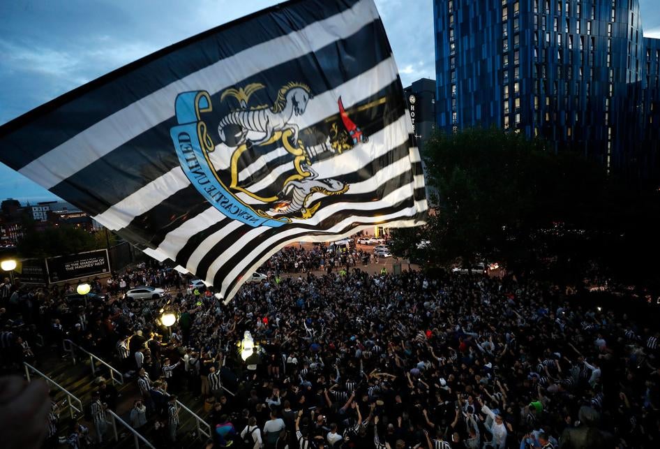 Fans react outside the stadium after the announcement of the Newcastle Takeover in St James' Park, Newcastle, Britain on October 7, 2021. 