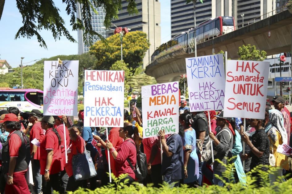 A group holding protest signs