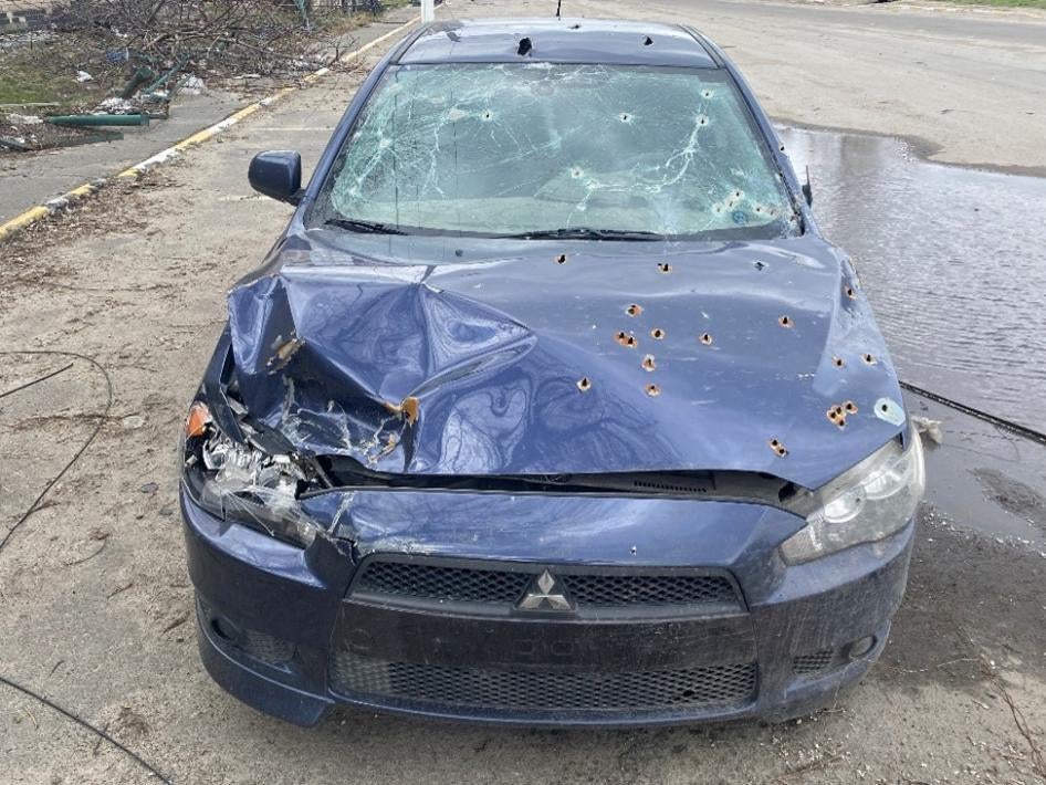 Russian forces in Hostomel opened fire on Oleksandr Maksymenko’s car while he was trying to evacuate on February 28, 2022, with his wife, son, and neighbor’s father. His son and neighbor’s father died.