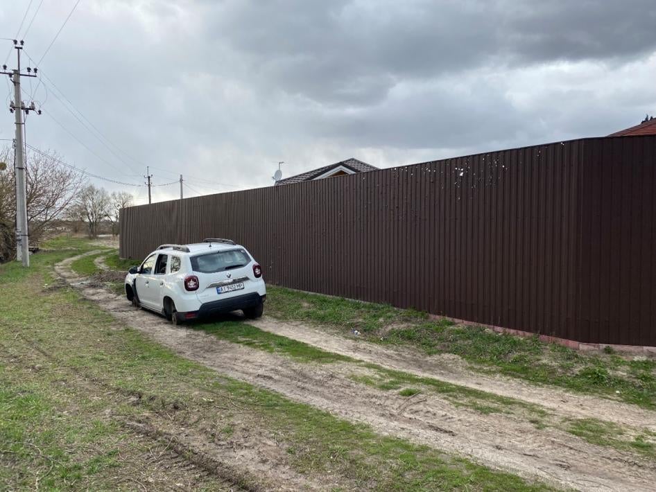Russian forces in Hostomel opened fire on this civilian vehicle in which Yurii Prylypko, Hostomel’s mayor, Yurii Shturma, Taras, and Ivan Zaria were driving on the afternoon of March 3, 2022. Prylypko and Zaria were killed.