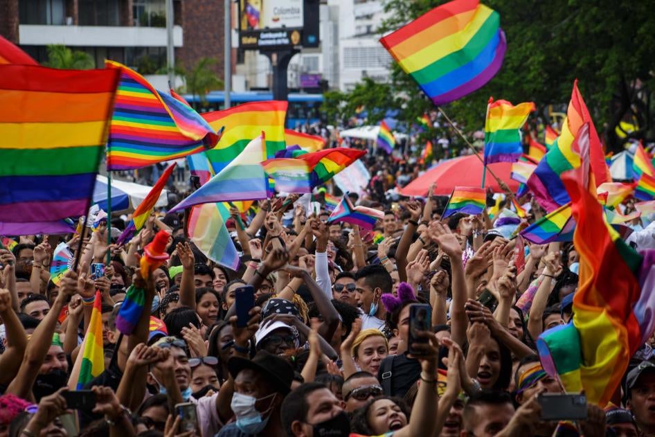 Flags of the LGTBIQ community raise and wave as people gather to protest and celebrate the International Pride Day celebrations in Cali, Colombia, July 4, 2021. 