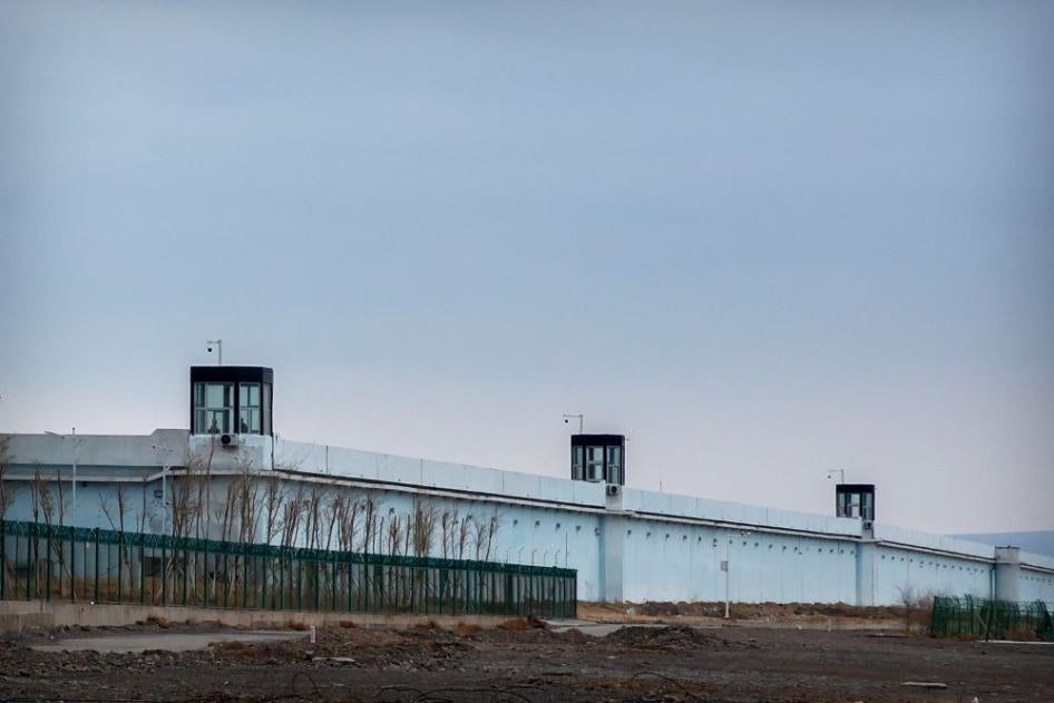Guard towers on the perimeter wall of the Urumqi No. 3 Detention Center