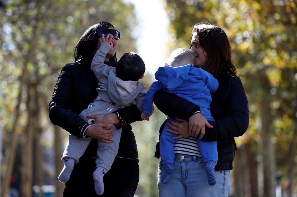 Amandine Giraud and her wife Laurene Corral with their children conceived with fertility assistance in Paris, France