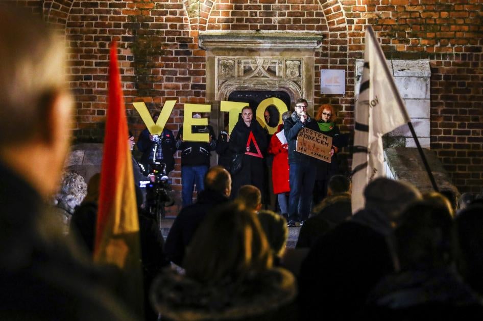 People attend a “Stop Lex Czarnek” protest at the Main Square in Krakow, Poland. 