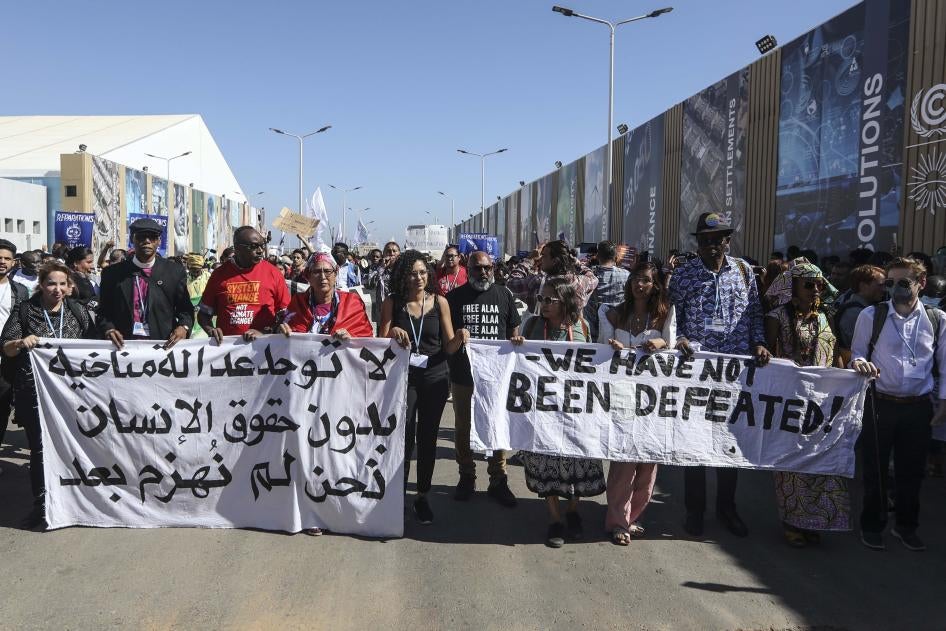 Sanaa Seif, sister of jailed Egyptian-British activist Alaa Abdel-Fattah, who went on a full hunger and water strike with the start of COP27 protesting his unjust imprisonment, takes part in the COP27 Coalition march during the 2022 United Nations Climate Change Conference COP27.