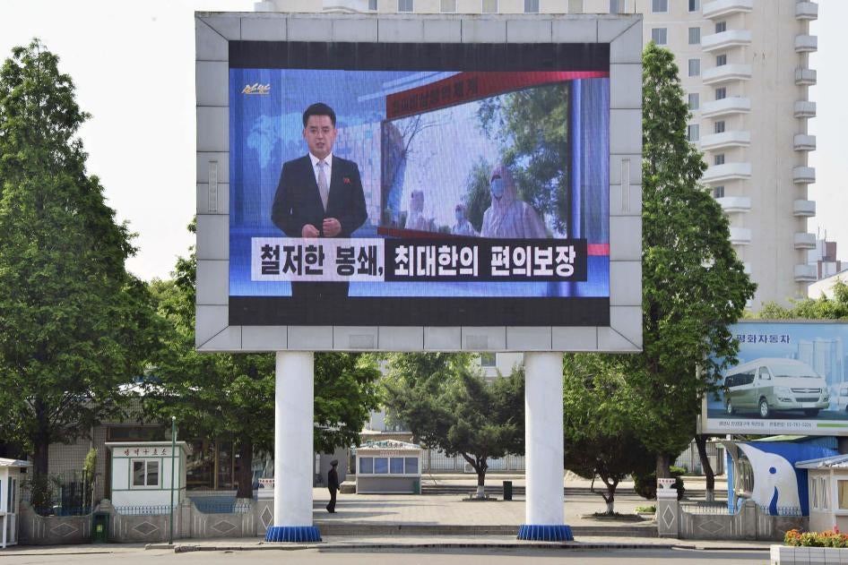 A billboard for North Korean state television in Pyongyang urges citizens to keep up their guard against Covid-19, May 23, 2022.