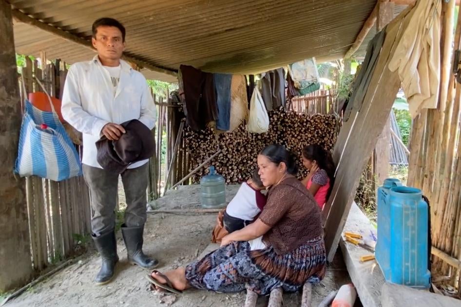 Hermelindo, his wife Claudia, and two of their children in their home