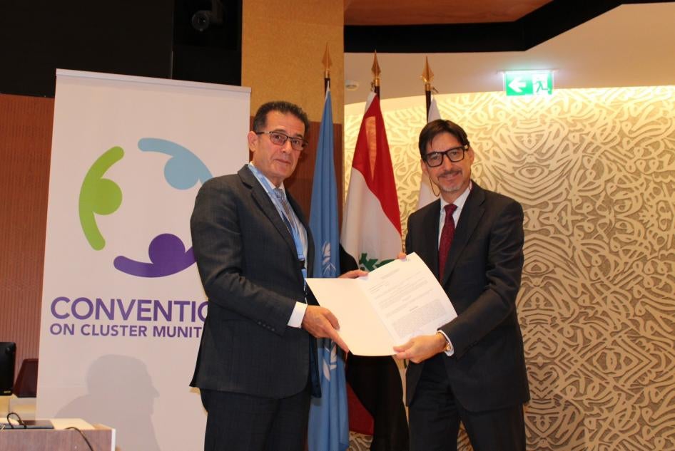 Amb. Yuri Sterk of Bulgaria (right) hands over formal documents confirming his country’s completion of the destruction of its stockpile of 6,862 cluster munitions and 186,349 submunitions to the president of the Convention on Cluster Munitions, Amb. Abdul Karim Hashim Mustafa of Iraq, September 12, 2023. 