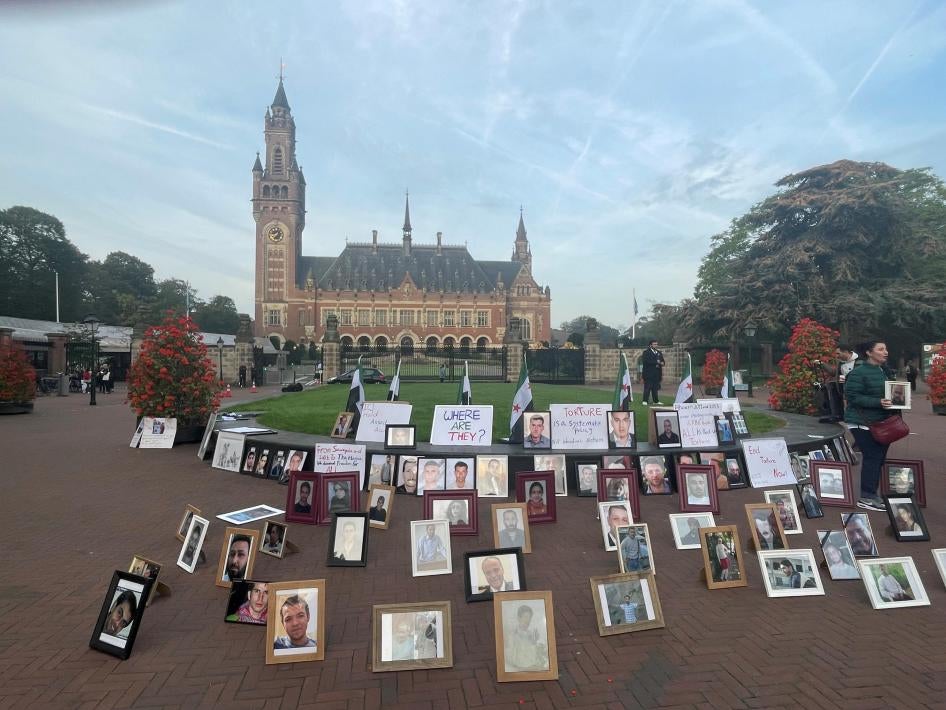 Photos of Syrians who have been detained or disappeared set up by their relatives, as part of a protest in front of the International Court of Justice in The Hague, Netherlands, on October 10, 2023.