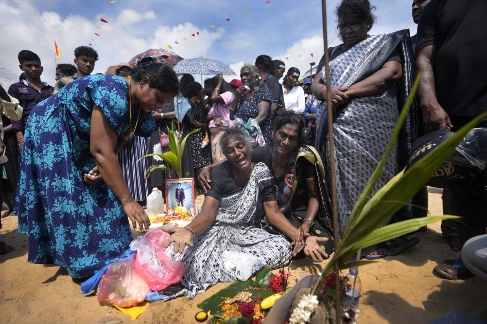 A Tamil woman cries for her deceased family members during a civil war remembrance in Mullivaikkal, Sri Lanka, May 17, 2024.