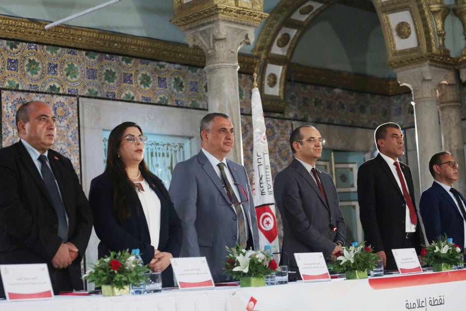 The Chairman of the Independent High Electoral Body (ISIE) Farouk Bouasker, (3-R) at a press conference to announce just three preliminary candidates for the presidential election to be held in Tunis on August 10, 2024. 